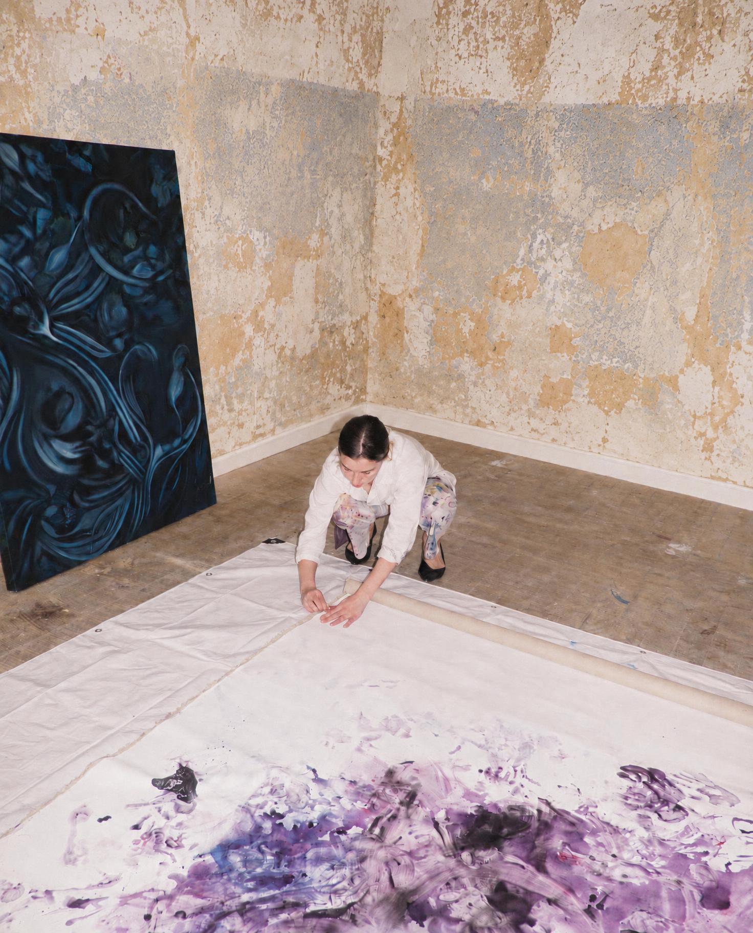 Blanc de Travail trousers worn while working on a painting on the floor